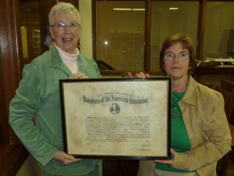 Brenda Babcock and Linda Dinsmore hold the original charter.